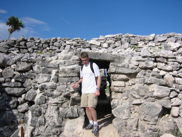 Scott climbing through the ruins